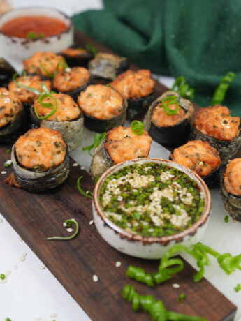 Crispy salmon bites wrapped in nori and rice paper, served with dipping sauces