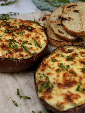 Twice-baked aubergine dip topped with melted mozzarella and fresh herbs