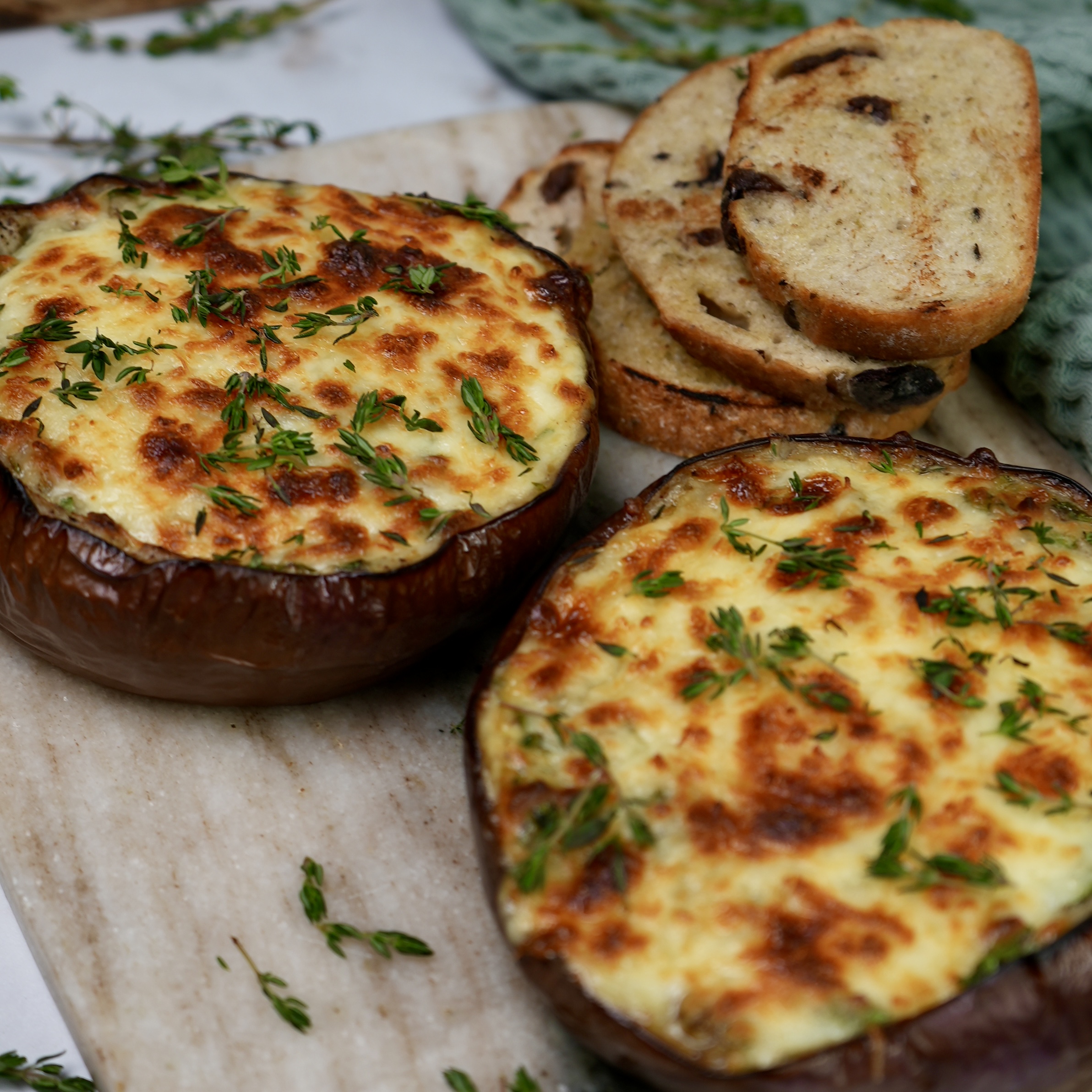 Twice-baked aubergine dip topped with melted mozzarella and fresh herbs