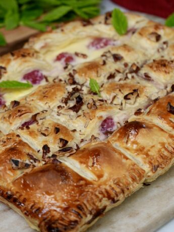 Creamy raspberry bites with golden puff pastry and a hint of custard.