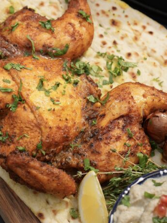 Lime and Turmeric Spatchcock Chicken served with baba ganoush.