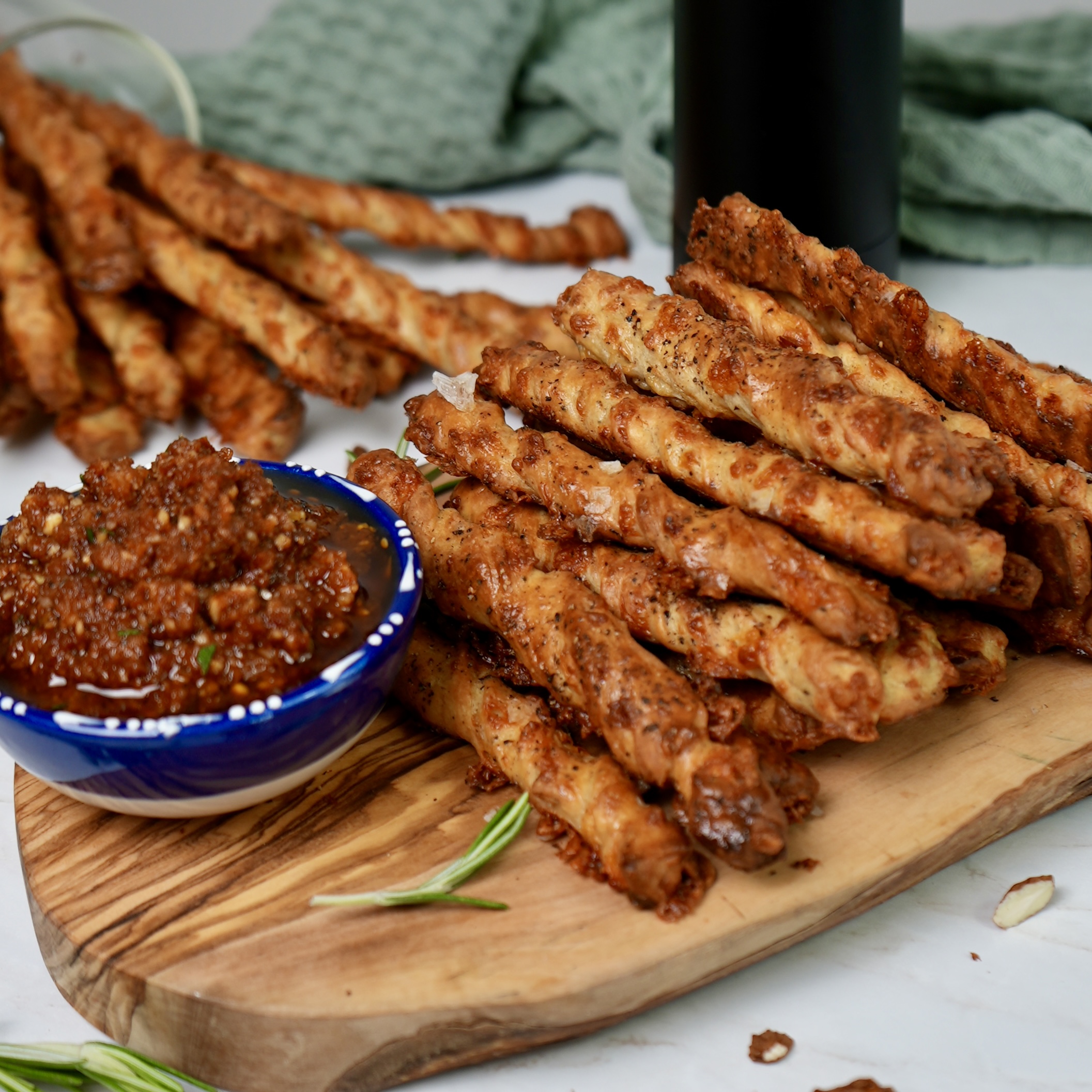 Freshly baked peppery cheesy breadsticks with dip