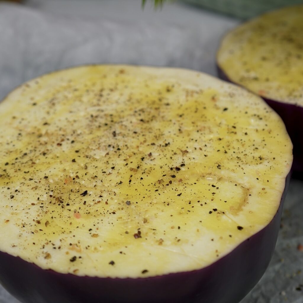 Aubergine halves scored in a diamond pattern