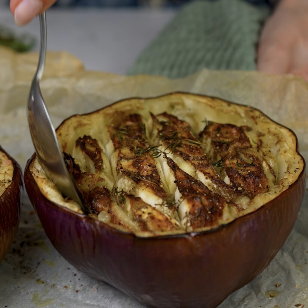 Baked aubergine halves, golden and tender