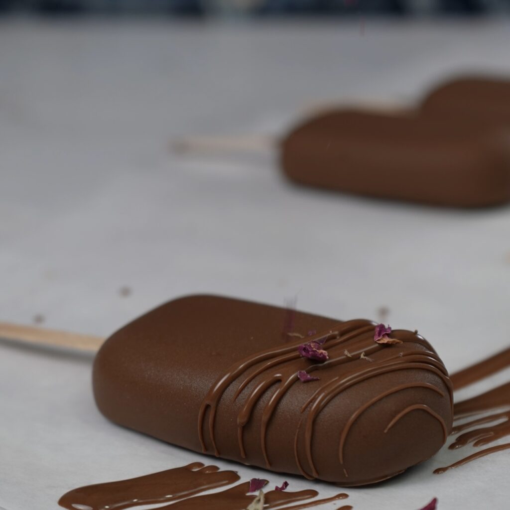 Frozen blueberry ricotta pops decorated with rose petals