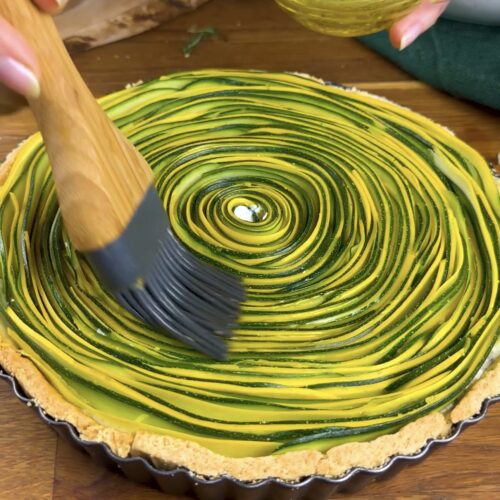 A photo of courgette strips brushed with olive oil.