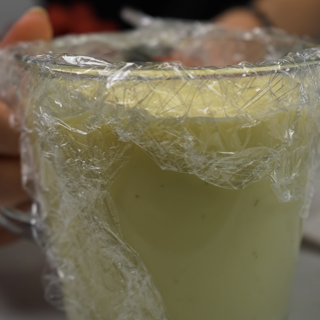 Custard for Creamy raspberry Bites being covered with cling film to cool.