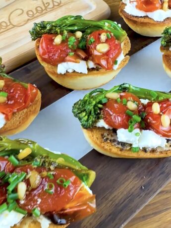 Roasted tomato and goat cheese toast topped with sautéed broccoli, pine nuts, and chopped chives.