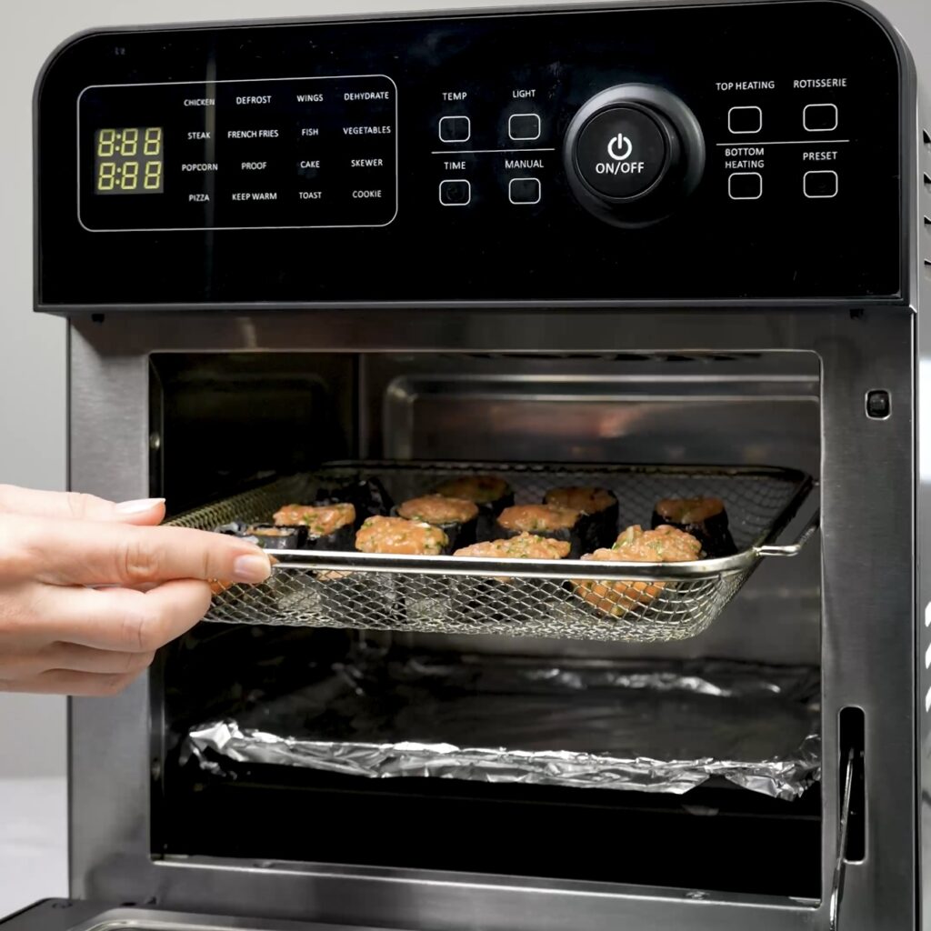 Air frying salmon bites in an air fryer basket