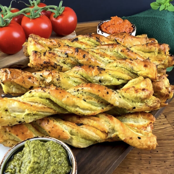 Golden Pesto Twists with a crispy texture and sprinkled with sesame seeds.