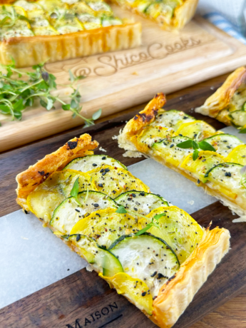 A Courgette Sun-dried Tomato Pesto Tart topped with sliced courgettes