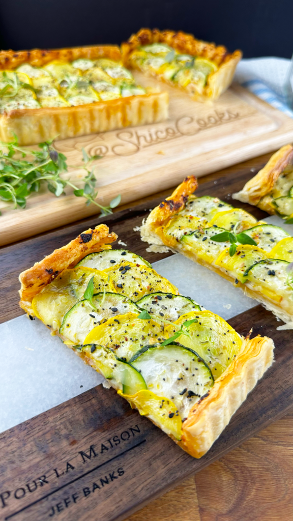 A Courgette Sun-dried Tomato Pesto Tart topped with sliced courgettes