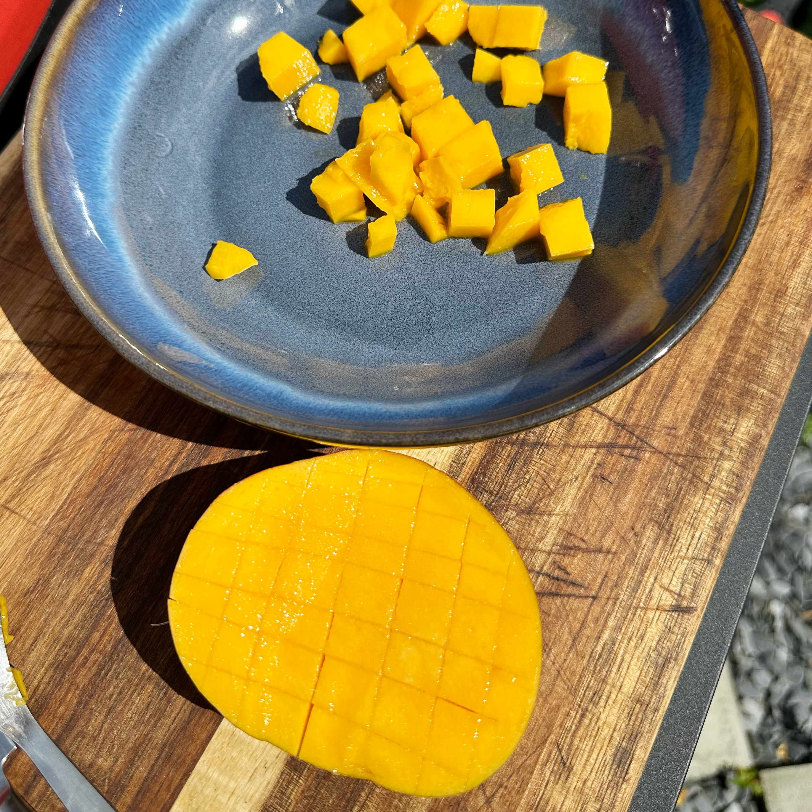 How to dice a mango: a mango being cut into cubes.