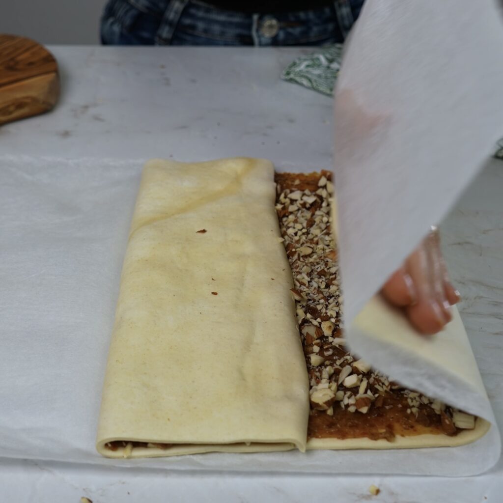 Folding puff pastry toward the centre