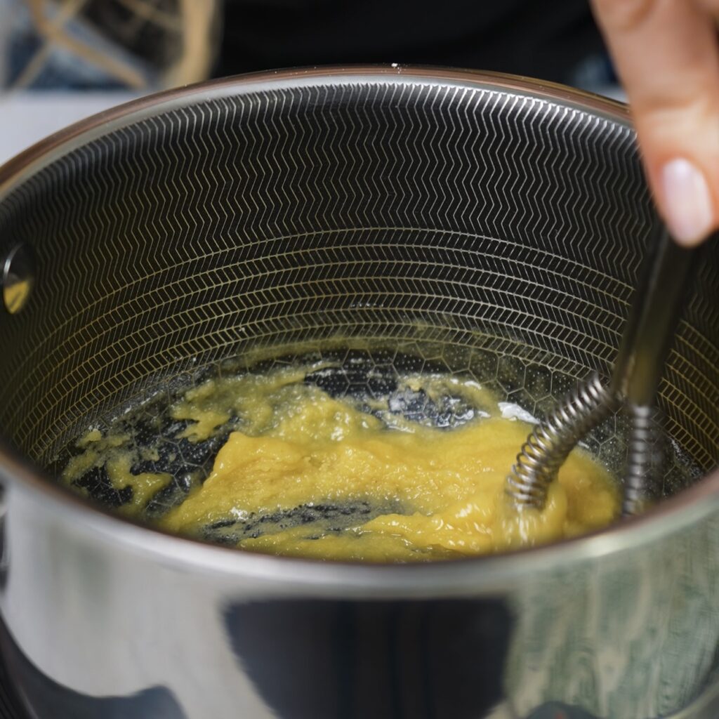 Cooking butter and flour in a saucepan.