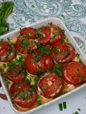 Stuffed tomatoes baked in béchamel sauce.