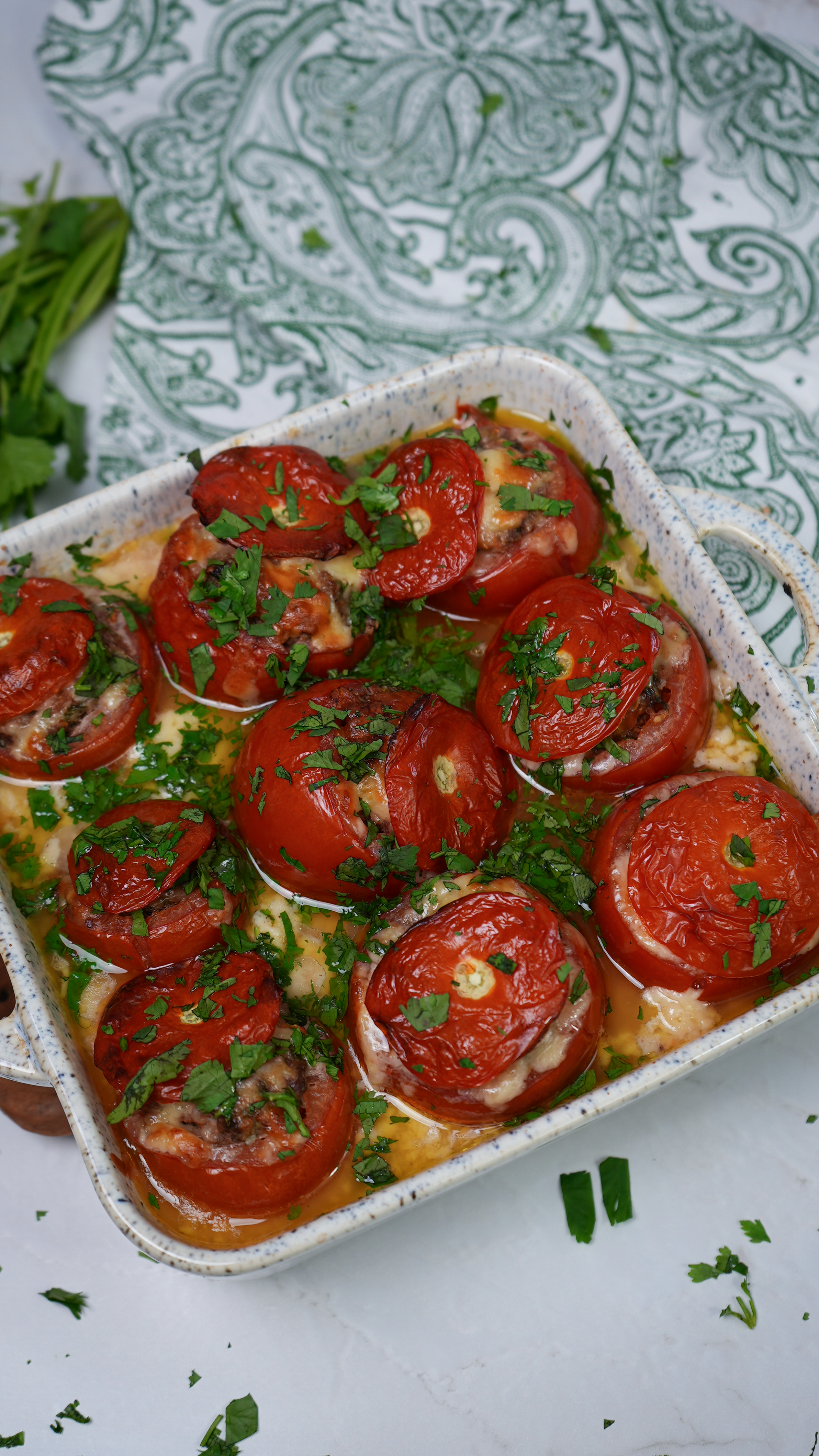 Stuffed tomatoes baked in béchamel sauce.