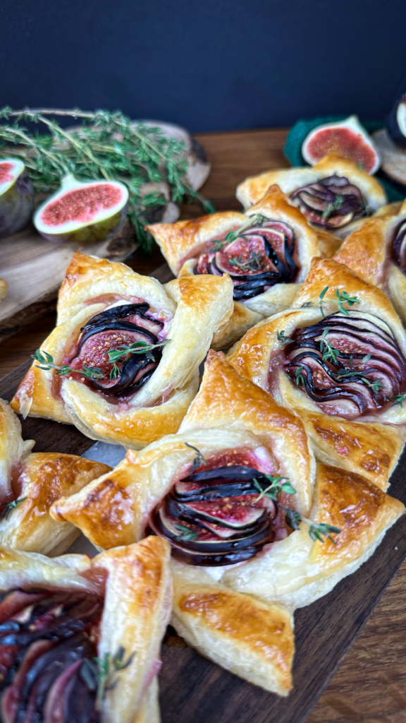 Golden puff pastry with goat cheese and baked figs.