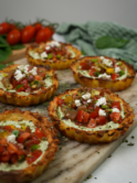 Mini Crushed Potato Tarts displayed on a serving board.