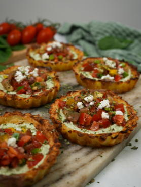 Mini Crushed Potato Tarts displayed on a serving board.