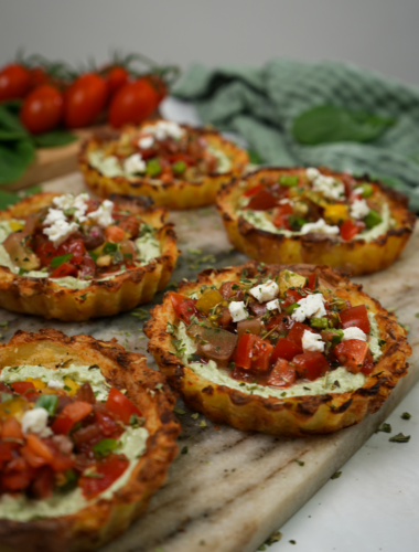 Mini Crushed Potato Tarts displayed on a serving board.