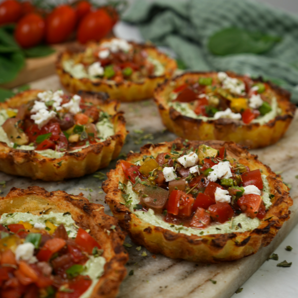 Mini Crushed Potato Tarts displayed on a serving board.