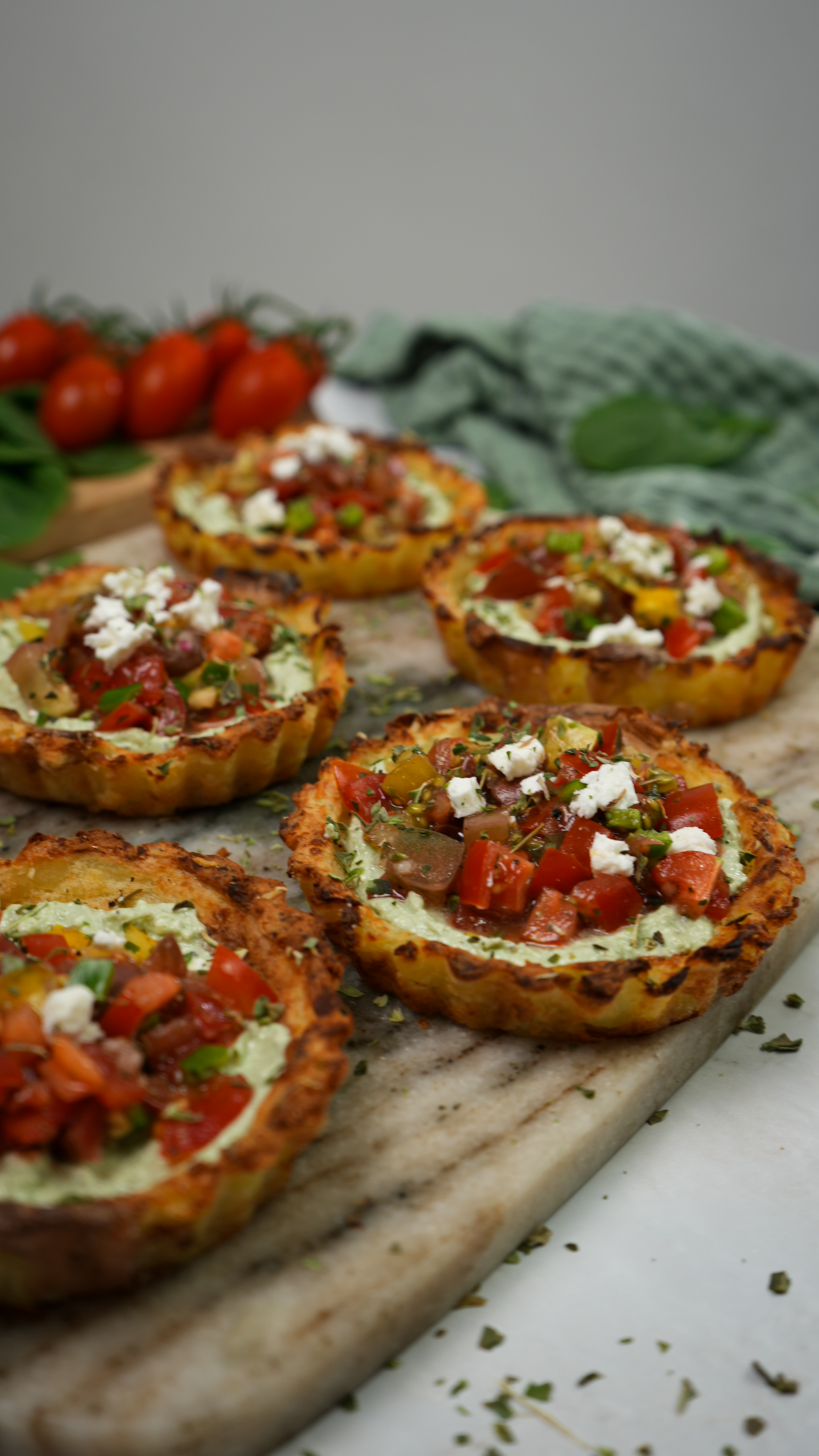 Mini Crushed Potato Tarts displayed on a serving board.