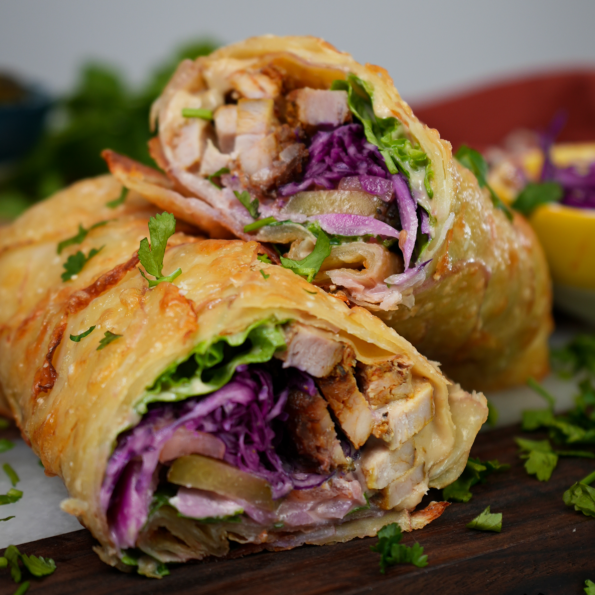 Gluten-free Potato Wrap Shawarma with a crispy Parmesan crust, filled with chicken shawarma, fresh vegetables, and hummus.