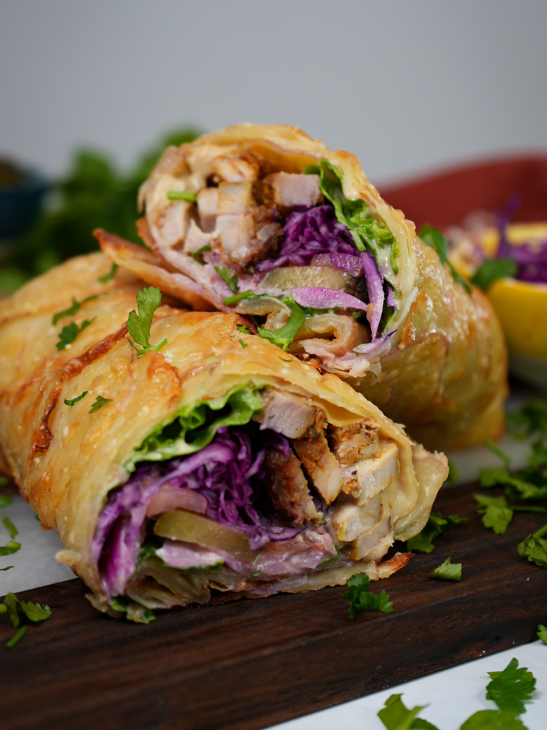 Gluten-free Potato Wrap Shawarma with a crispy Parmesan crust, filled with chicken shawarma, fresh vegetables, and hummus.