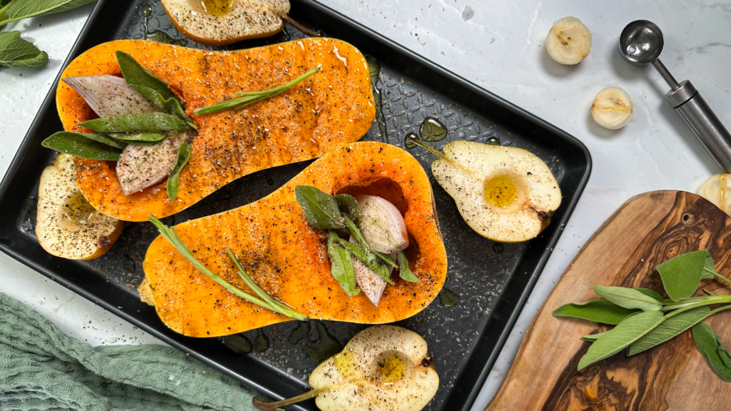 Veggies arranged on a baking tray, ready for roasting.