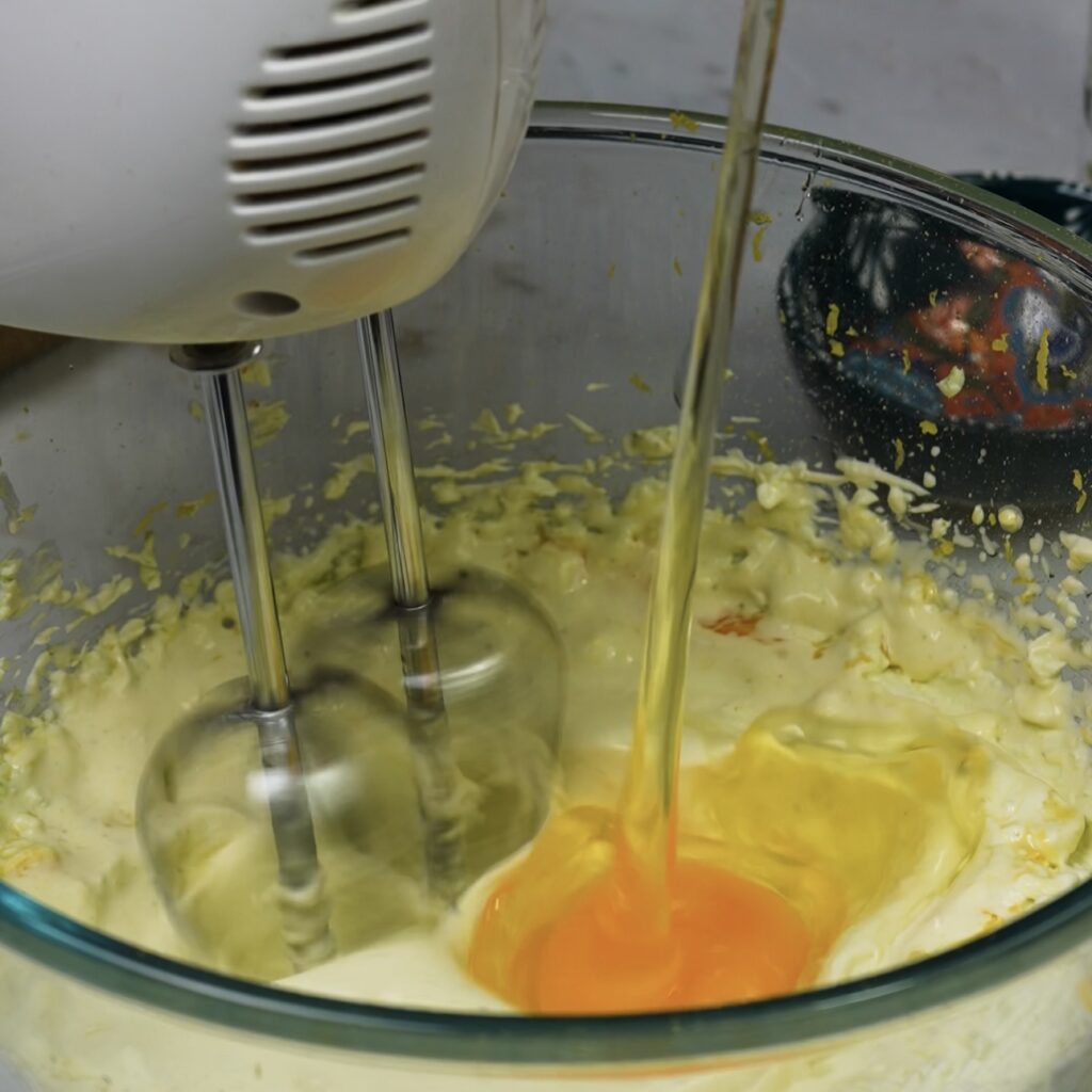 Whisking together ingredients for the filling in a mixing bowl until smooth.