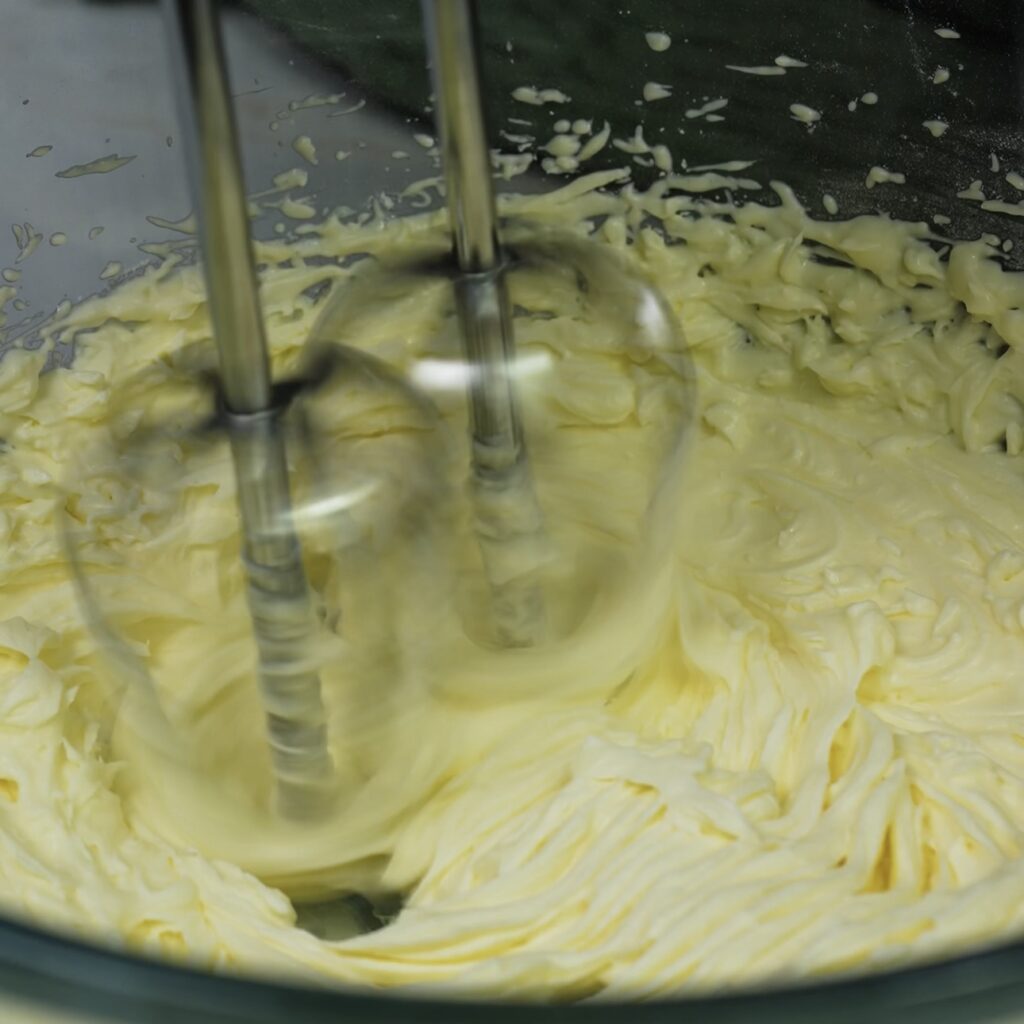 Whisking cream cheese for cookie shot filling