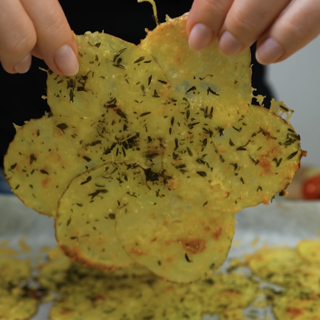 Baked potato flower shape, golden and ready to be shaped into a cup.