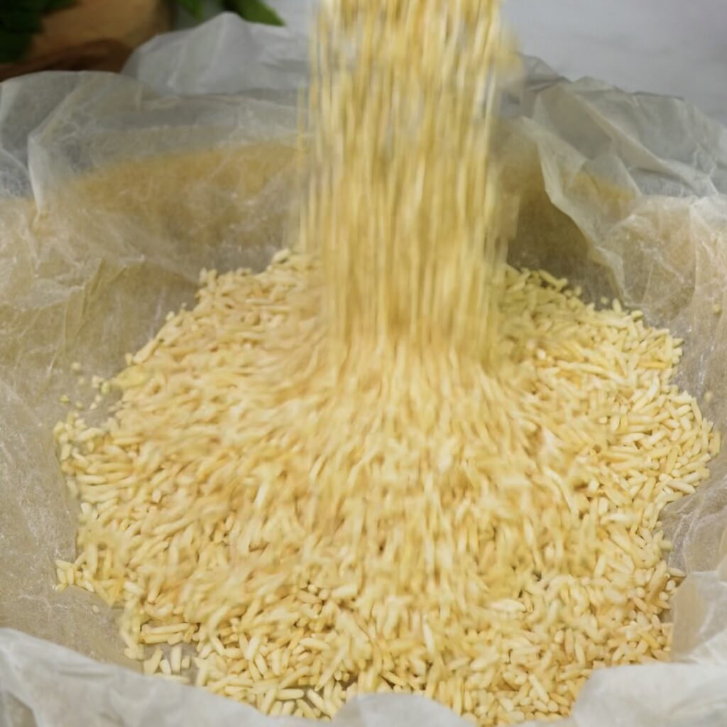 Lining tart crust with parchment and uncooked rice.