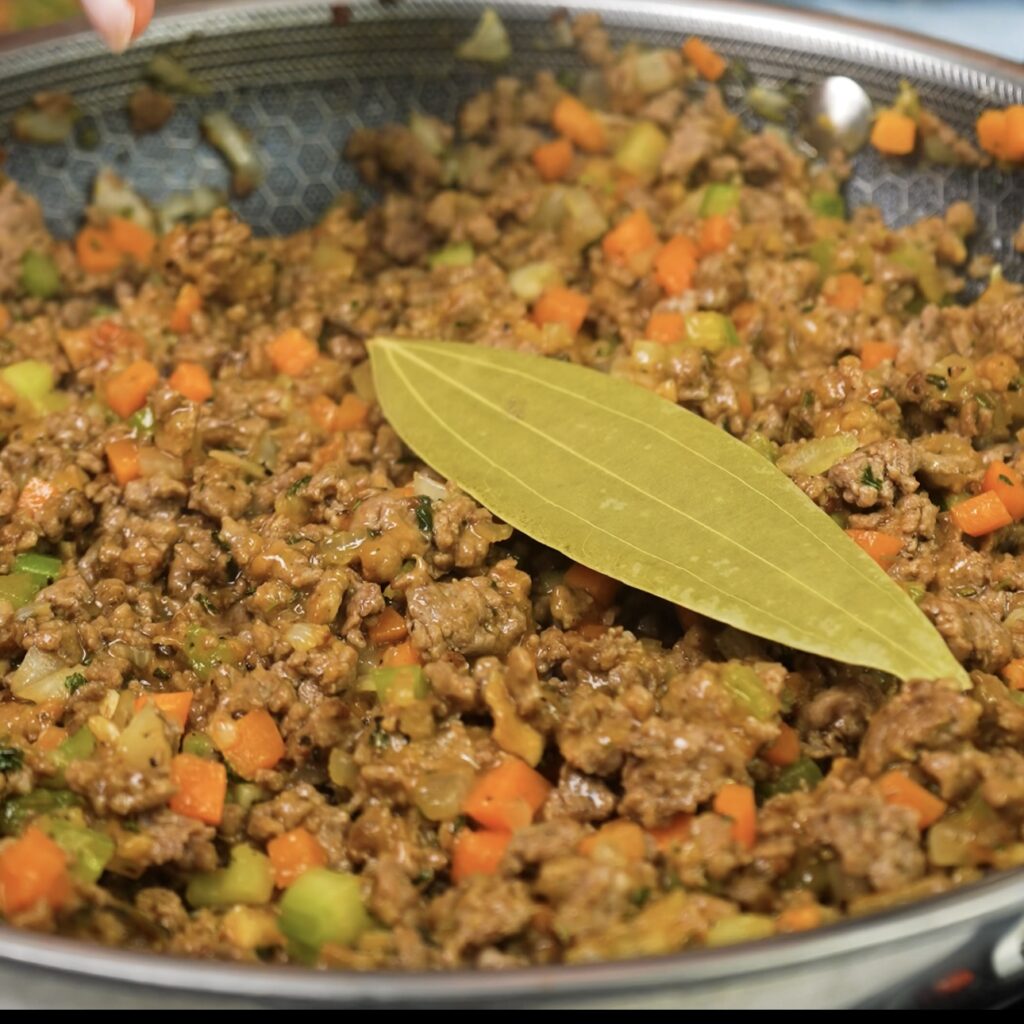 Minced beef and vegetables simmering for Cottage Pie filling