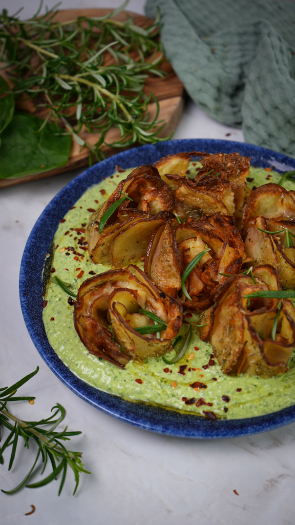 Potato roses nestled on a bed of spinach feta.