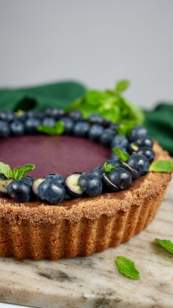 Berry Semolina Tart with blueberries and mint.