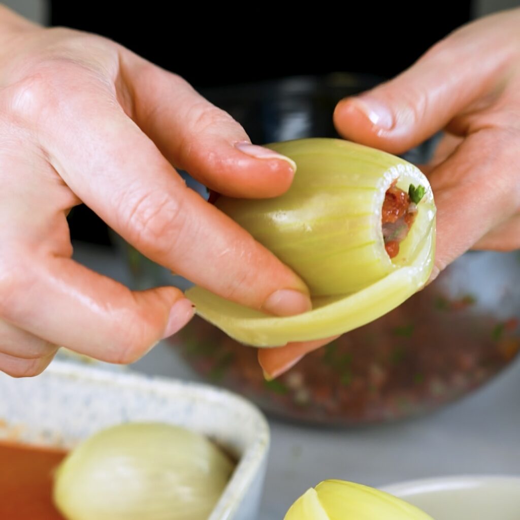 Stuffing onion layers with spiced ground beef mixture