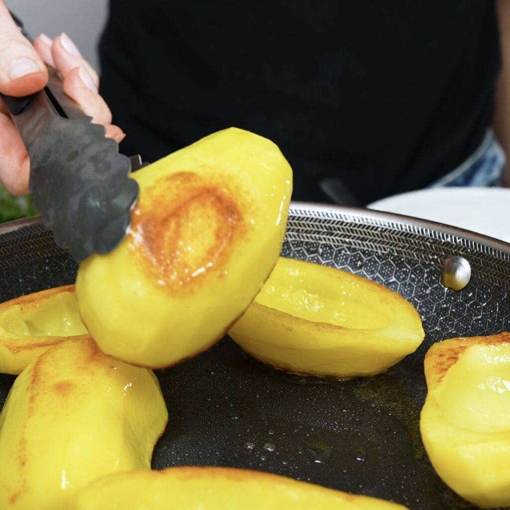 Frying the hollowed-out potato halves until golden and crispy.