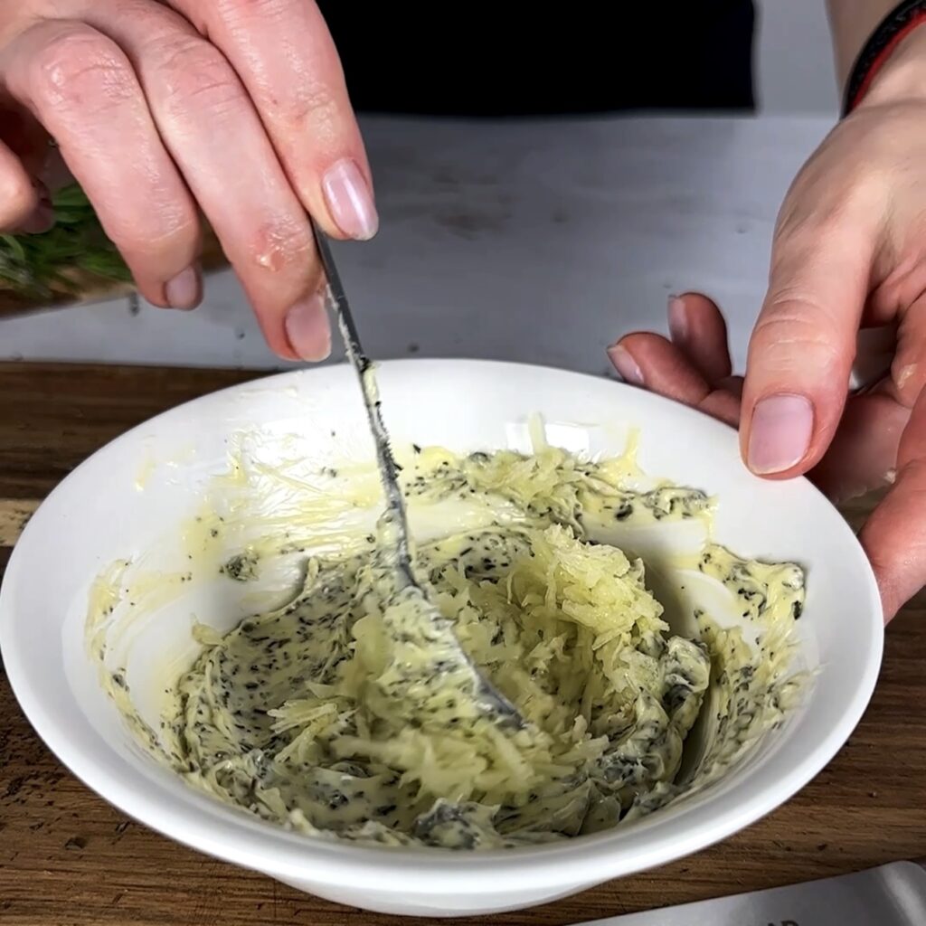 Softened butter mixed with rosemary, thyme, and garlic for garlic herb butter.