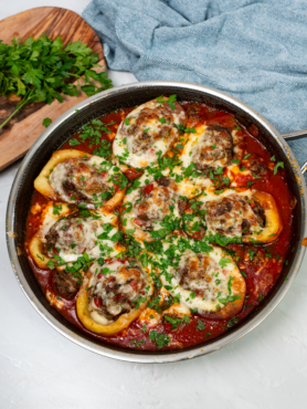 Savoury stuffed potato boats with spiced minced meat, melted mozzarella, and fresh coriander.