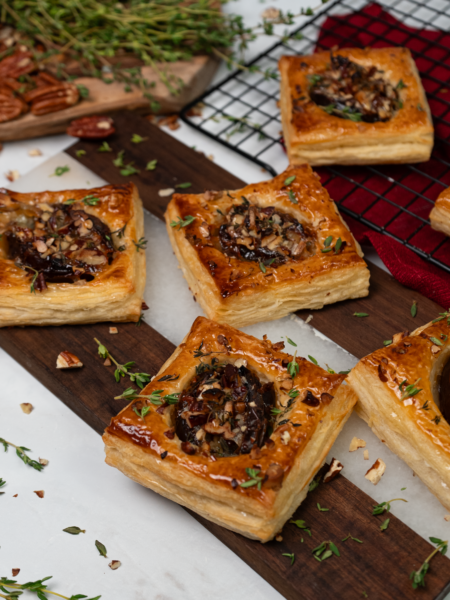 Date and Gorgonzola puffs garnished with honey and fresh thyme.