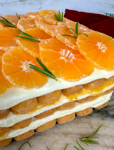 Mandarin Tiramisu topped with fresh mandarin slices and rosemary.