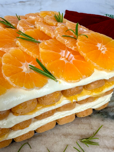 Mandarin Tiramisu topped with fresh mandarin slices and rosemary.