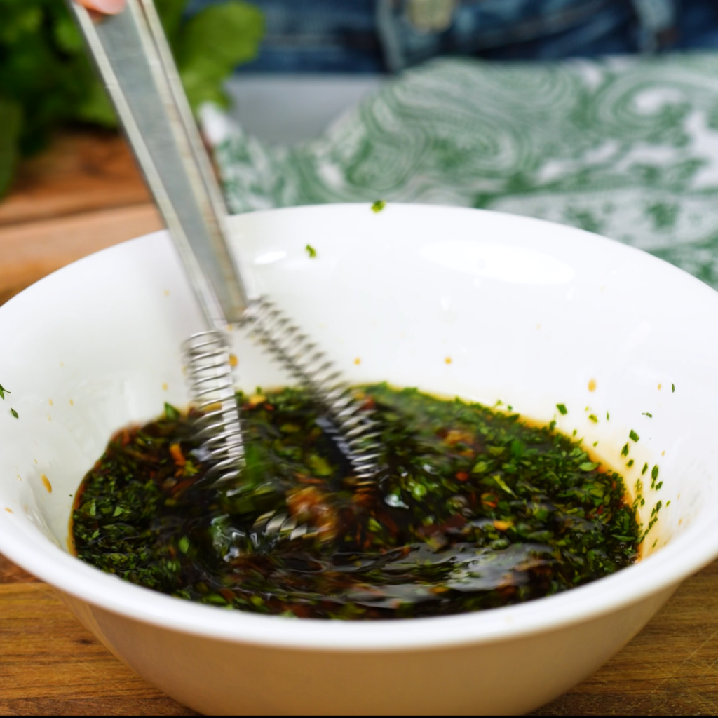 Mixing ingredients for a spring roll dipping sauce.