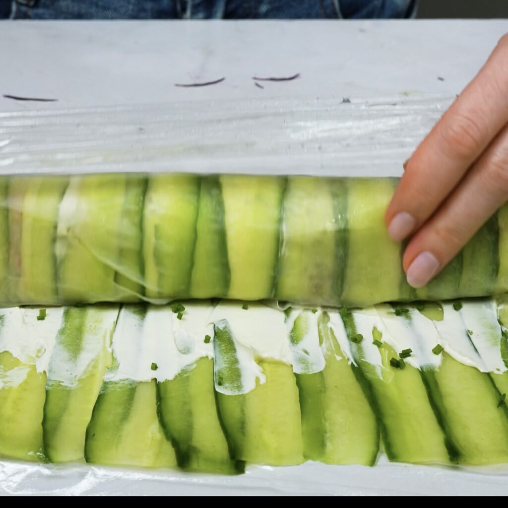 Rolling up the rice paper roll with the filling.