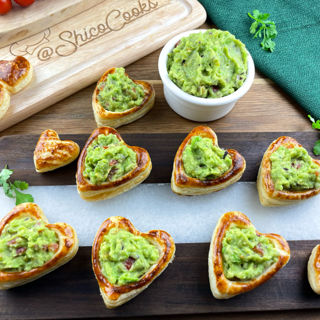 Heart-shaped puff pastries filled with guacamole.