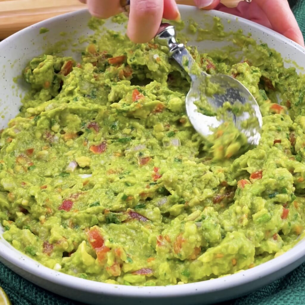 Preparing fresh guacamole.