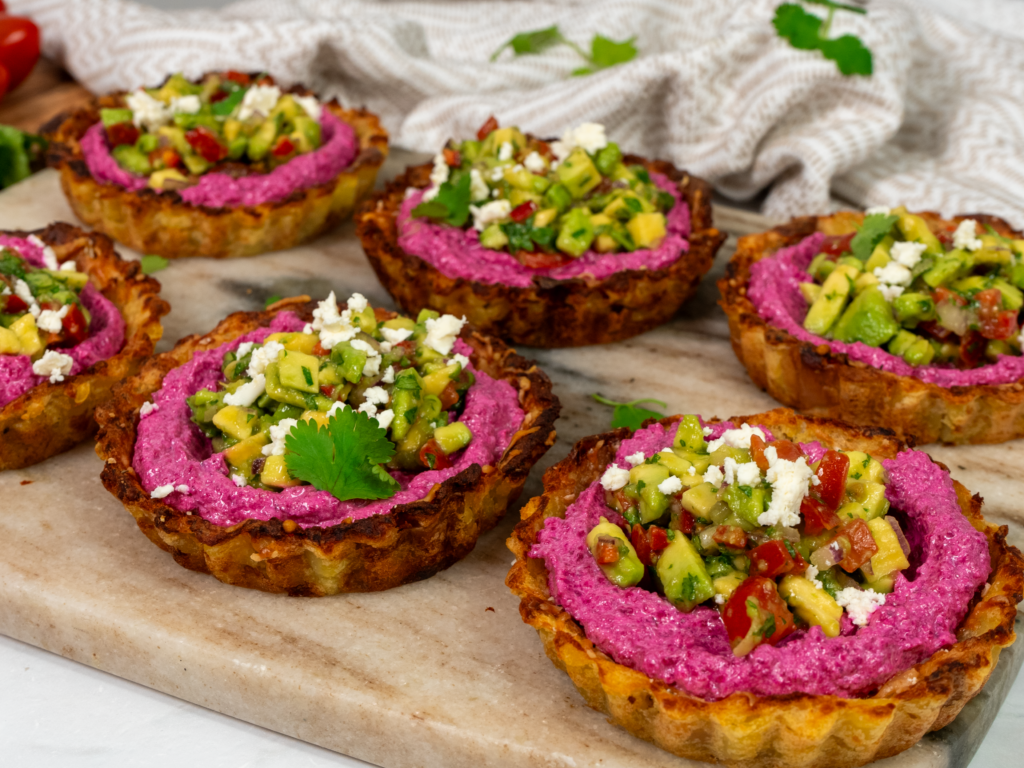 Potato tarts filled with beetroot feta and topped with avocado salsa.