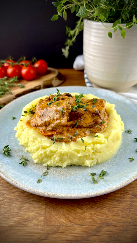 Creamy mushroom chicken served over mashed potatoes.